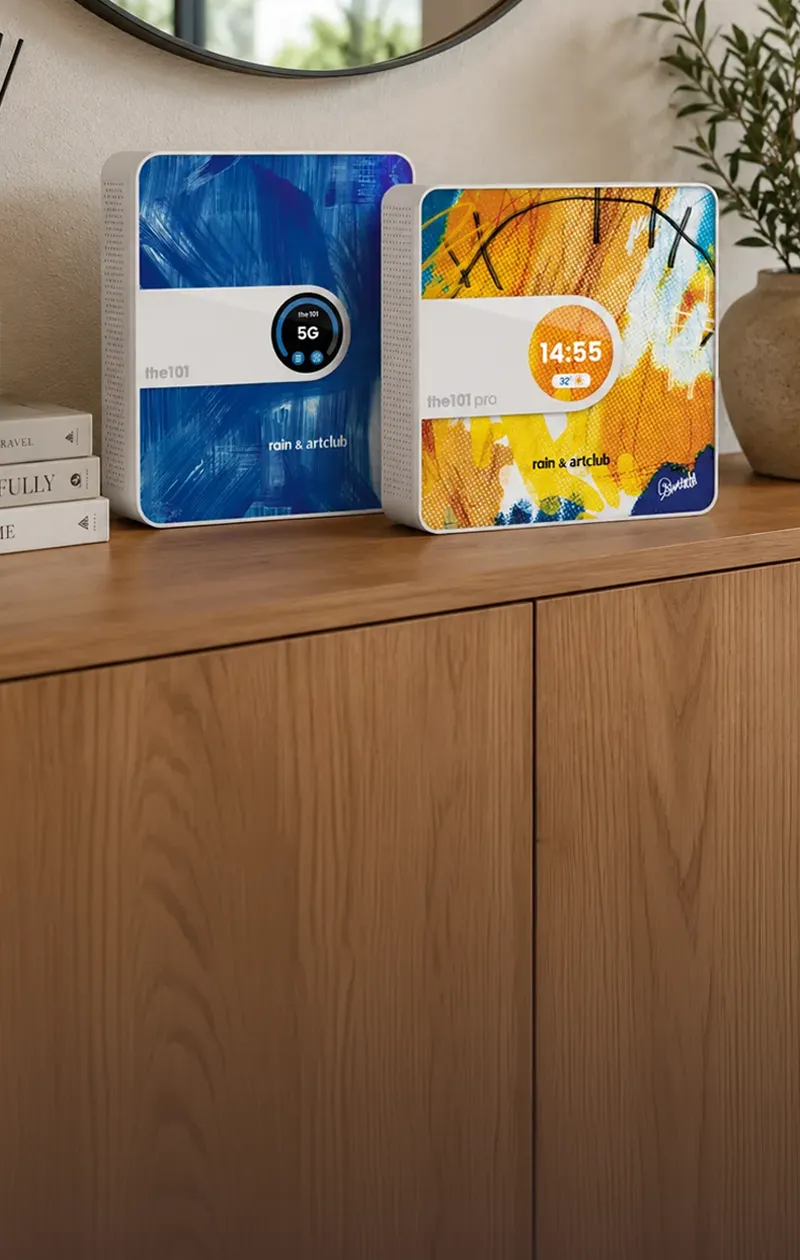 two the101 5G smart routers, dressed in Art Club skins, on a console